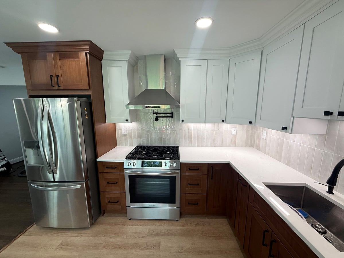 Range wall with pot filler and hood