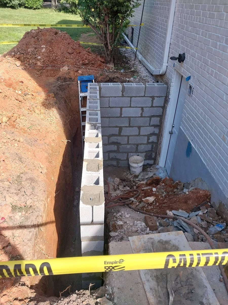 Before: excavation and new block walls